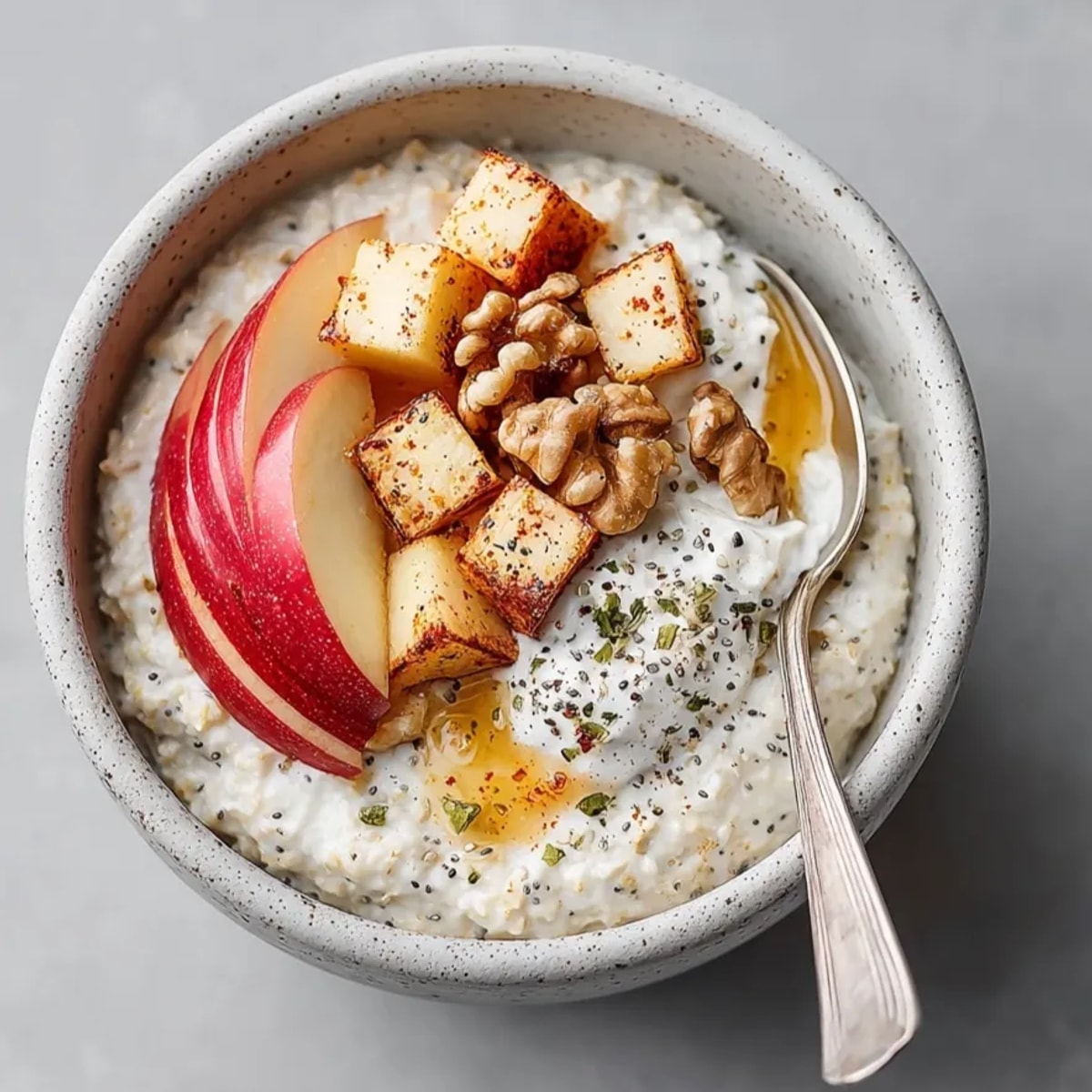 Creamy Cinnamon Apple Overnight Oats, a simple, spiced breakfast soaking in milk overnight.