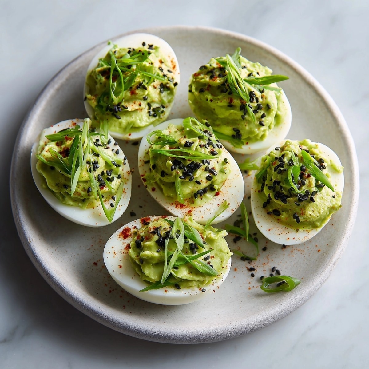 Vibrant Ghastly Green Deviled Eggs: A Halloween appetizer with spicy wasabi filling.