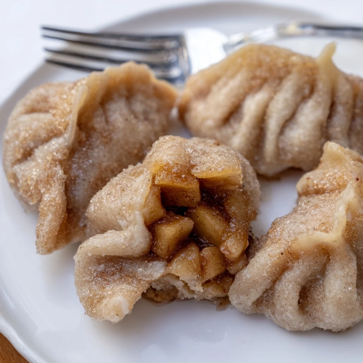 Tender Rustic Rye & Apple Dumplings, golden-brown, filled with spiced apple goodness.  