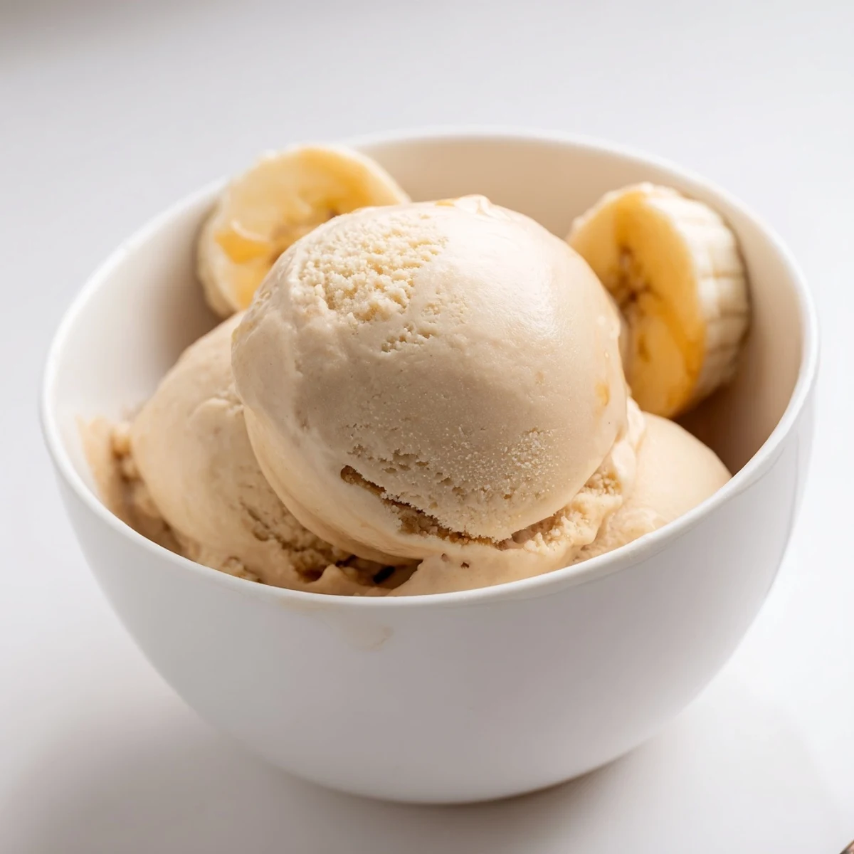 Homemade peanut butter banana ice cream, a picture of freshly blended, easy frozen treat for anyone!