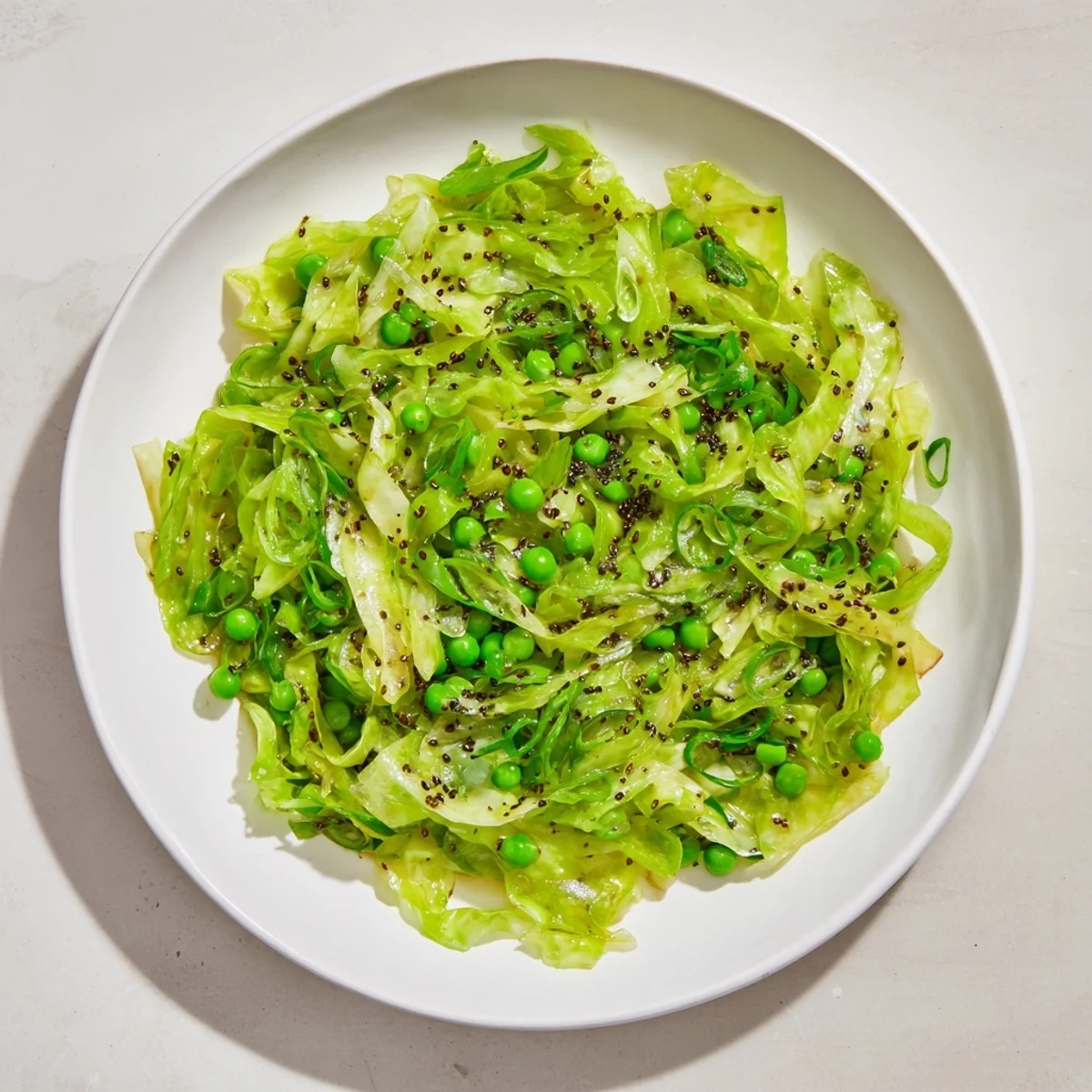 Vibrant Cabbage Stir-Fry with garlic, soy and peas: A delicious, colorful vegetable side dish, ready in minutes.