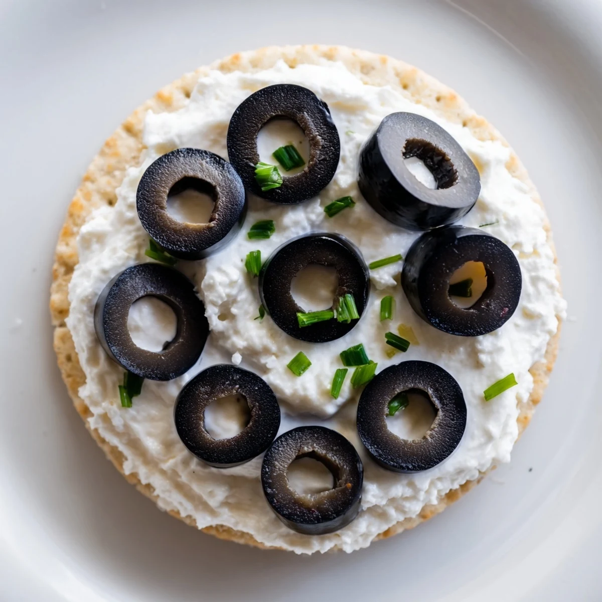 Golden Medal Olympic Ring Appetizers are vibrant, colorful crackers with cream cheese and assorted toppings.
