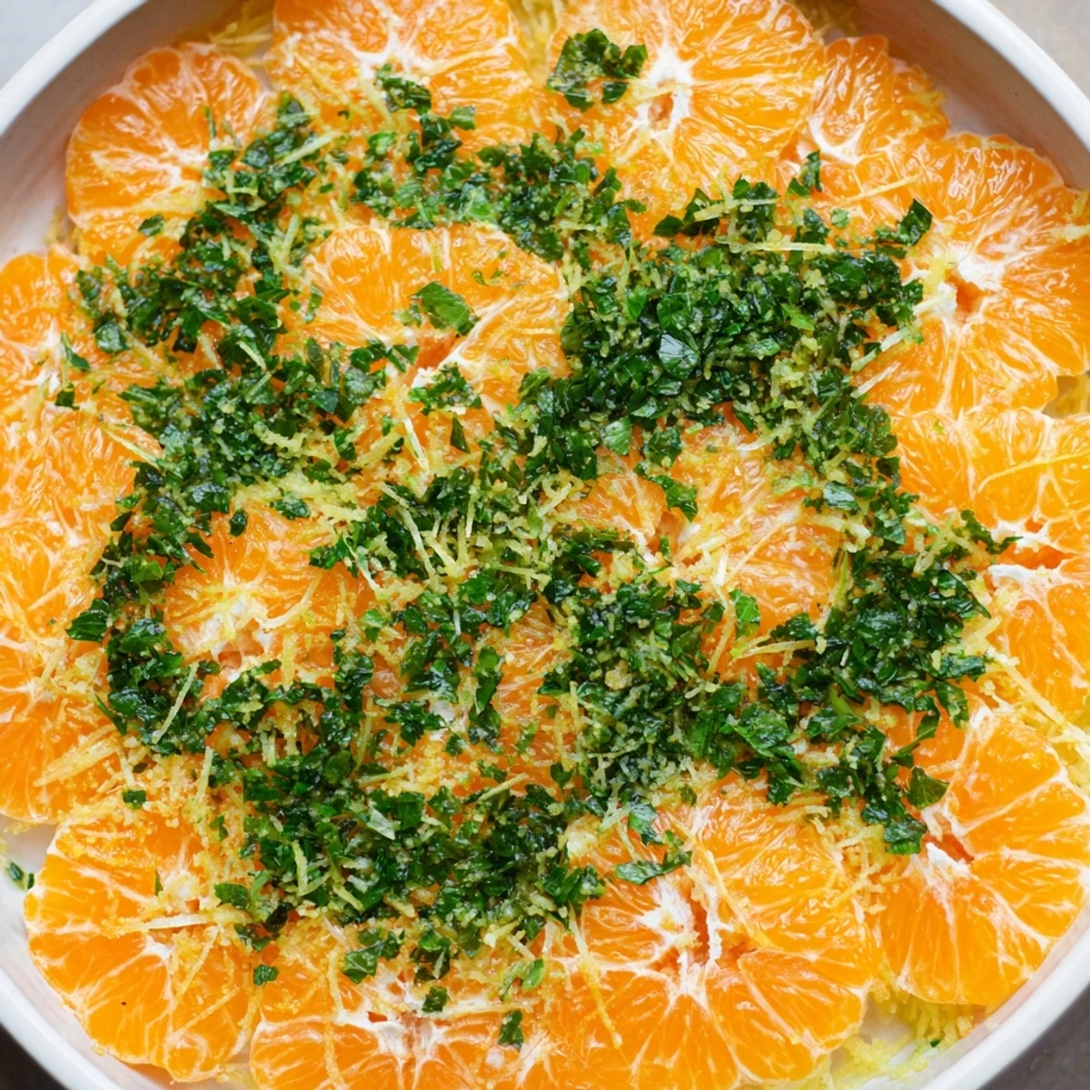 Vibrant clementine and mint winter fruit salad, bursting with citrus flavor, ready to enjoy.