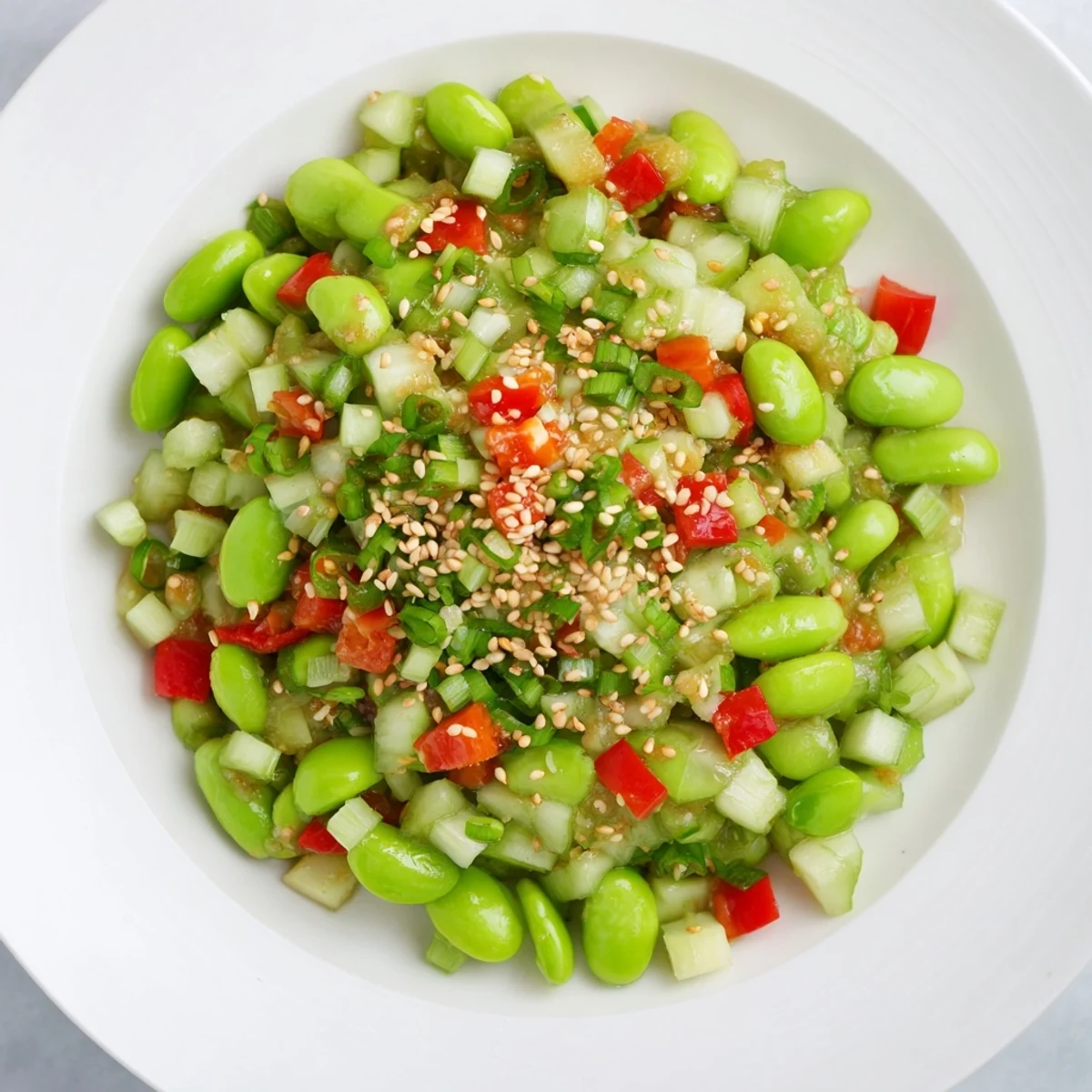 Chilled Edamame Salad with crisp cucumber; imagine the sesame dressing glistening on each bite.