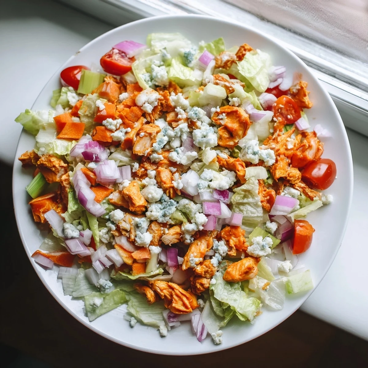 Enjoy a refreshing and flavorful Buffalo Chicken Chopped Salad, perfect for any occasion.