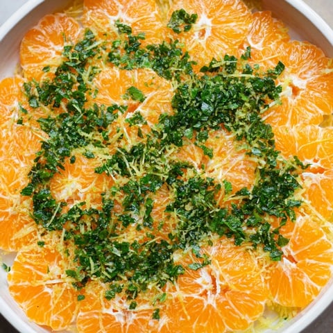 Vibrant clementine and mint winter fruit salad, bursting with citrus flavor, ready to enjoy.