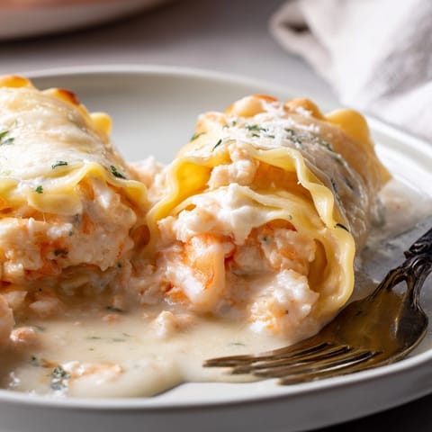 Close-up of Shrimp Alfredo Lasagna Rolls, cheesy and fragrant, a comforting Italian dinner.