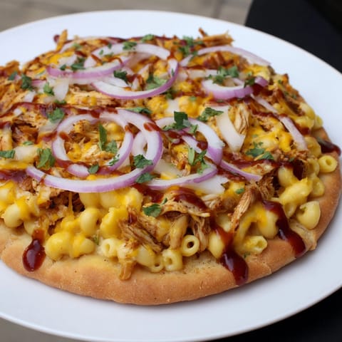 Golden brown Mac and Cheese BBQ Chicken Pizza, oven-baked and topped with cilantro.