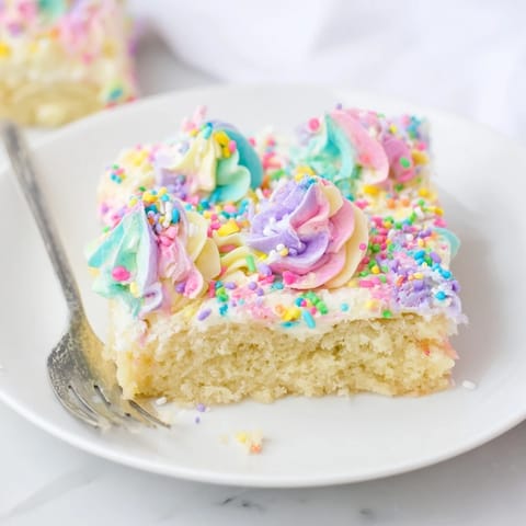 Delightful homemade Not-So-Perfect Birthday Sheet Cake, vibrant frosting and festive sprinkles adorn.  