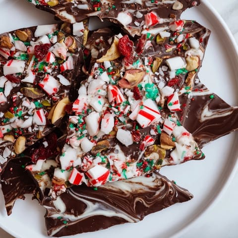 Festive holiday bark shards with crushed peppermint, perfect for a delicious chocolate dessert.