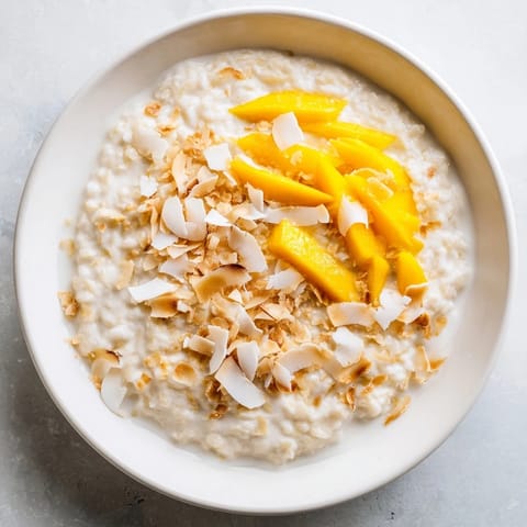 A close-up shot of decadent, comforting Toasted Coconut Rice Pudding, perfect for a tropical dessert.