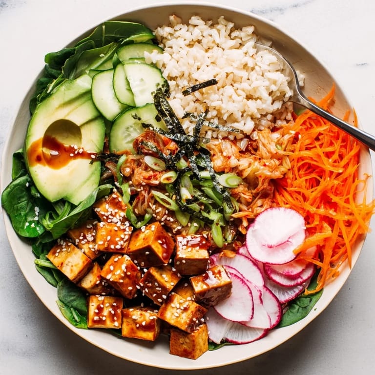 Vibrant fermented vegetable bowl topped with avocado, radishes, and crunchy sesame seeds.