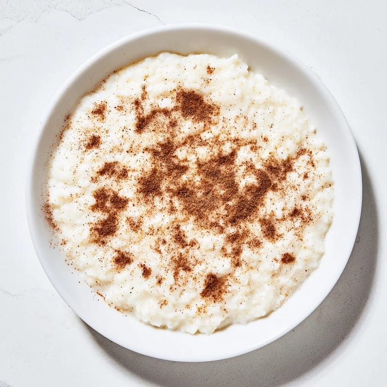 Garnished with cinnamon, this creamy Rice Pudding with leftover rice offers a sweet, simple dessert.