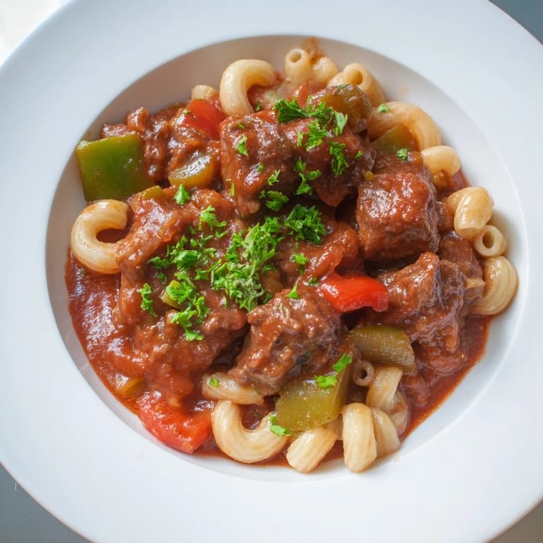 A close-up of a flavorful goulash with tender beef and pasta, perfect for dinner.