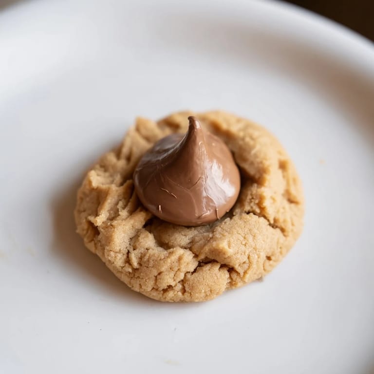 Close-up of delightful 3-Ingredient Peanut Butter Blossoms, sweet and simple, waiting to be enjoyed.