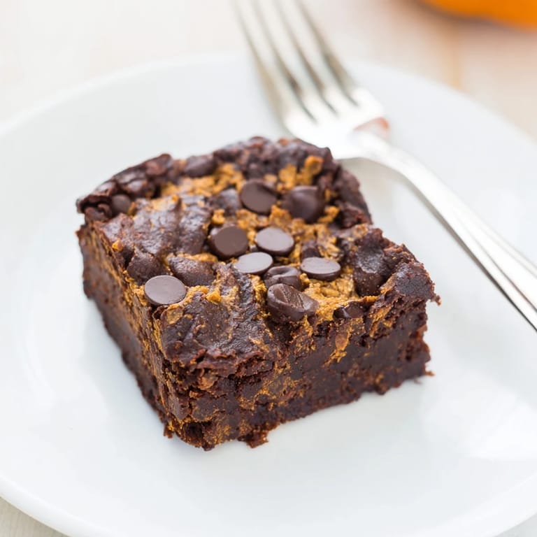 Warm, chocolatey scent; these soft Pumpkin Workout Brownies are ready to be cut and enjoyed.