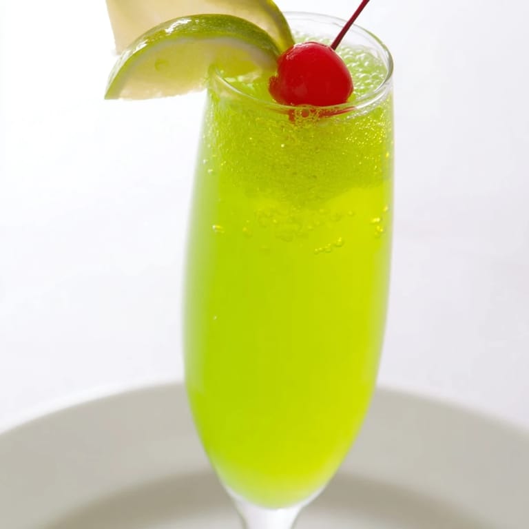Enjoy a refreshing Quick Grinch Mimosa Mocktail bursting with citrus flavors, perfect for easy holiday joy.