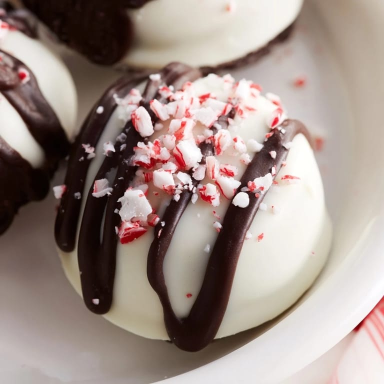 Close-up of decadent Simplified Christmas Oreo Truffles, showcasing a creamy, dark center and bright sprinkles.