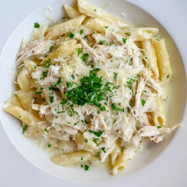Delicious, comforting Tinis Creamy Chicken Pasta: a saucy American-Italian dinner with penne, perfect for a cozy night.