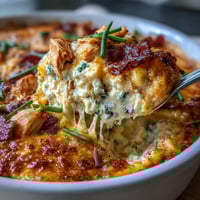 Creamy high-protein cottage cheese Buffalo chicken dip baked until bubbly and topped with green onions.